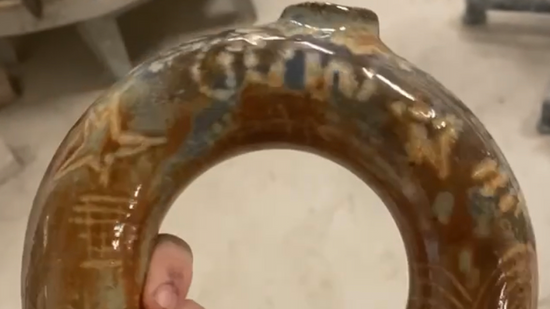 throwing a donut flask